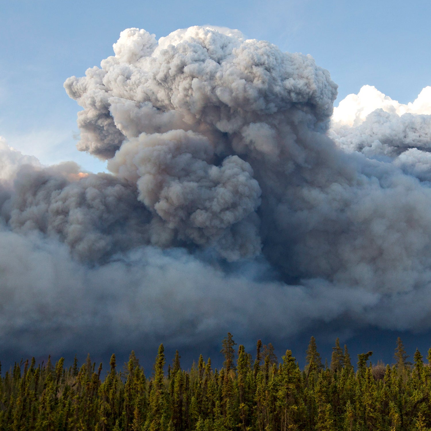 The wildfires raged across Northern Alberta and forced the evacuation of about 88,000 people in May, damaging Fort McMurray neighborhoods, oil-production facilities and businesses.