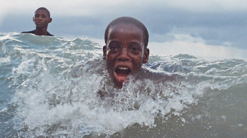 It's always amazing to be in the water with surfers, but between heats kids would pour off of the beach to body surf. I was a bit of an anomaly, holding a camera, popping up right as the wave was breaking, trying to capture for a moment the child's joy of being swept up in the ocean.