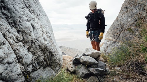 Swaney inspects a rock-pile anchor in Sand Witch Canyon. May 21, 2016.
We are now climbing a steep ridgeline toward an unnamed summit, at which point we鈥檒l traverse around and drop into a drainage that will deepen into a canyon. I ask Plummer if I can trust Swaney. Plummer鈥檚 accompanied him on about 30 canyoneering trips in Death Valley, including many first descents. He tells me that Swaney knows what he鈥檚 doing. He also tells me that I need to make my own decisions about what is safe and what is not. I respect his response.
