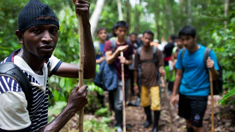 Gambian Morro Kanteh with fellow migrants from Bangladesh and Nepal in the Darién Gap.