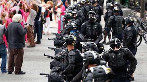 Demonstrators march by police during the Shut Down Trump & the RNC protest on July 17 in Cleveland.