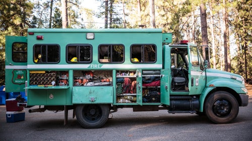 You need the right gear to go trail running, skiing, or mountain biking. You really need the right stuff if you spend weeks fighting infernos in the middle of a forest. To find out what wildland firefighters rely on, we hooked up with Kevin Mecham, a 12-year veteran with the Tahoe Hotshots.
International Crew Haul
Mecham and the Tahoe Hotshots named their 2006 two-wheel-drive crew hauler Eight Ball. The squad boss drives, the captain rides shotgun, and the eight crew members sit in the back, with the most senior toward the front and the newest guys in the back. All of their tools go into side compartments, while their personal gear fits in racks and nets above the seats.