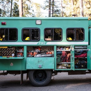 You need the right gear to go trail running, skiing, or mountain biking. You really need the right stuff if you spend weeks fighting infernos in the middle of a forest. To find out what wildland firefighters rely on, we hooked up with Kevin Mecham, a 12-year veteran with the Tahoe Hotshots.
International Crew Haul
Mecham and the Tahoe Hotshots named their 2006 two-wheel-drive crew hauler Eight Ball. The squad boss drives, the captain rides shotgun, and the eight crew members sit in the back, with the most senior toward the front and the newest guys in the back. All of their tools go into side compartments, while their personal gear fits in racks and nets above the seats.