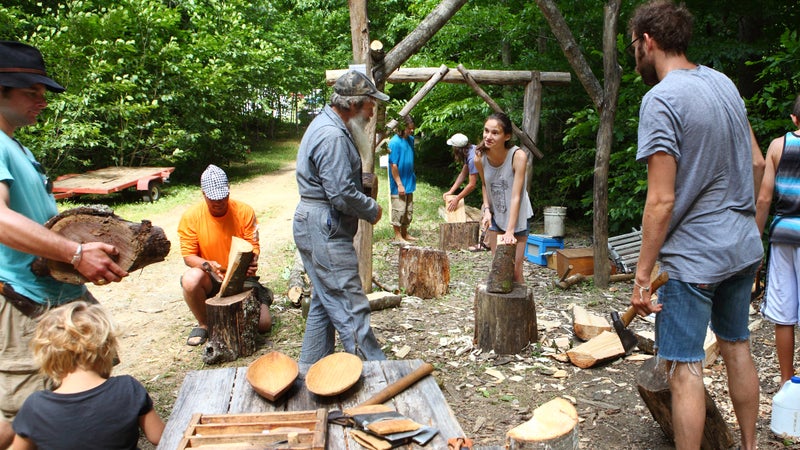Firefly Gathering participants learned skills including how to carve dishes, chop wood, and build fires.