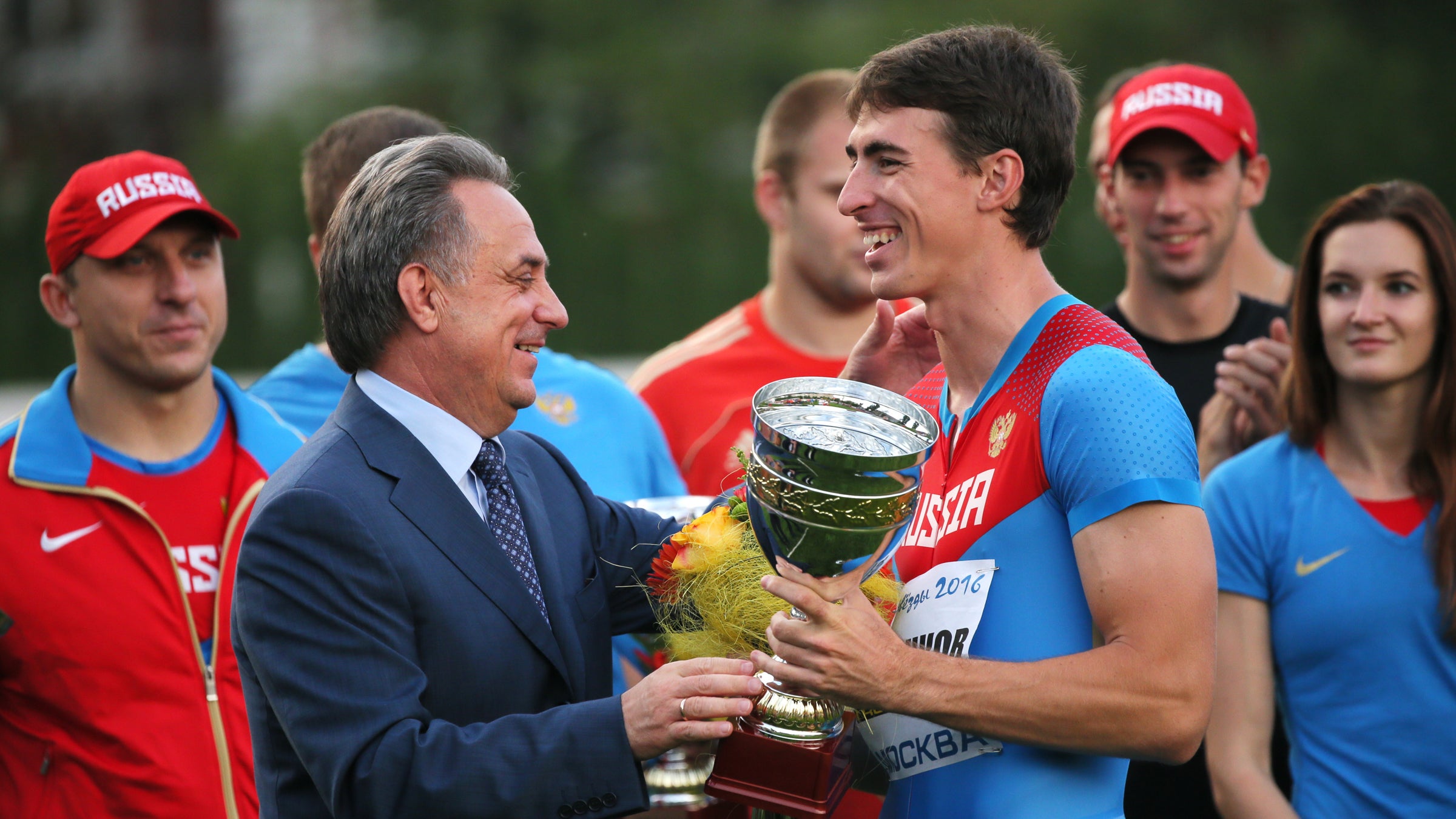 Russia's sports minister Vitaly Mutko and athlete Sergey Shubenkov during a medal ceremony at the Olympian's Cup.
