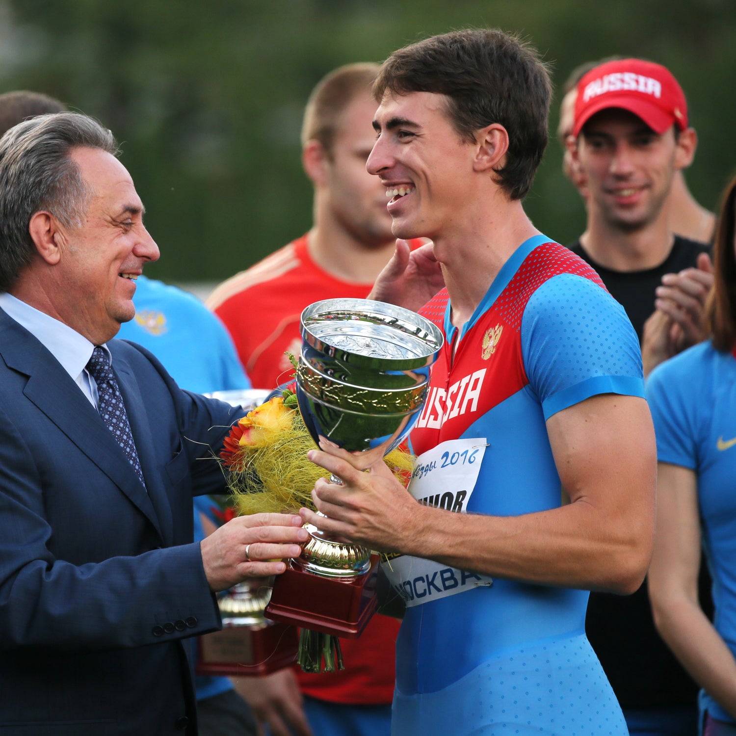 Russia's sports minister Vitaly Mutko and athlete Sergey Shubenkov during a medal ceremony at the Olympian's Cup.