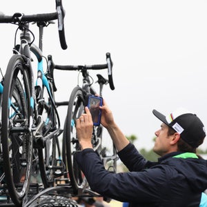 A UCI inspector examines bikes of Team Sky to detect hidden motors ahead of stage four of the Tour de France.