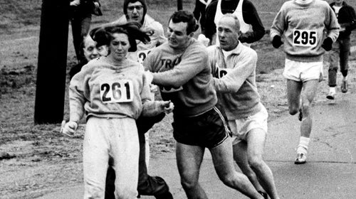 At the 1967 Boston Marathon, Kathrine Switzer resists as race director Jock Semple tries to remove her from the course. Switzer told the story of that race in 'Free to Run.'