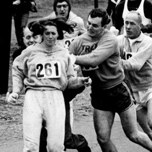 At the 1967 Boston Marathon, Kathrine Switzer resists as race director Jock Semple tries to remove her from the course.