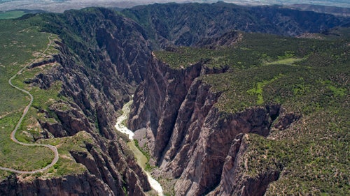 The Gunnison River has its headwaters in some of the highest terrain in Colorado, beginning at the Continental Divide as the race to the Sea of Cortez begins. The canyon鈥檚 drop is precipitous, so it is kind of scary to be flying at the exact point where this photo was taken. It feels as though the canyon will swallow the airplane whole.
From the book 鈥淲here the Colorado River is Born.鈥