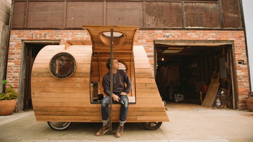 Ten years ago, Nelson cobbled together his first mobile camper, a wooden snail shell that sat on the back of a Honda Civic and served as his home while he chased swells at Ocean Beach.