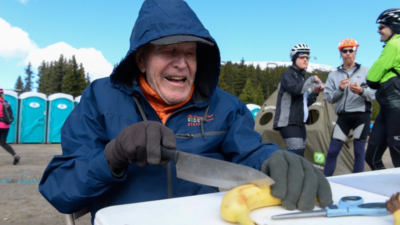 FREMONT PASS, CO - JUNE 14: Don Siekmeier of Denver cuts bananas for riders at an Aid Station during day three of the 31st annual Ride the Rockies on June 14, 2016. Ride the Rockies cyclists rode the Copper Triangle 79 miles through Leadville and the Vail Pass. (Photo by Michael Reaves/The Denver Post via Getty Images)