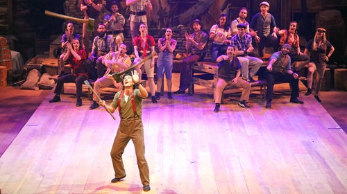 Dolly Parton's Lumberjack Adventure features axes, dogs, and lots of moonshine.