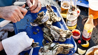 Eating osters and fried seafood on the deck at Bowens Island Restaurant in Charleston, SC.