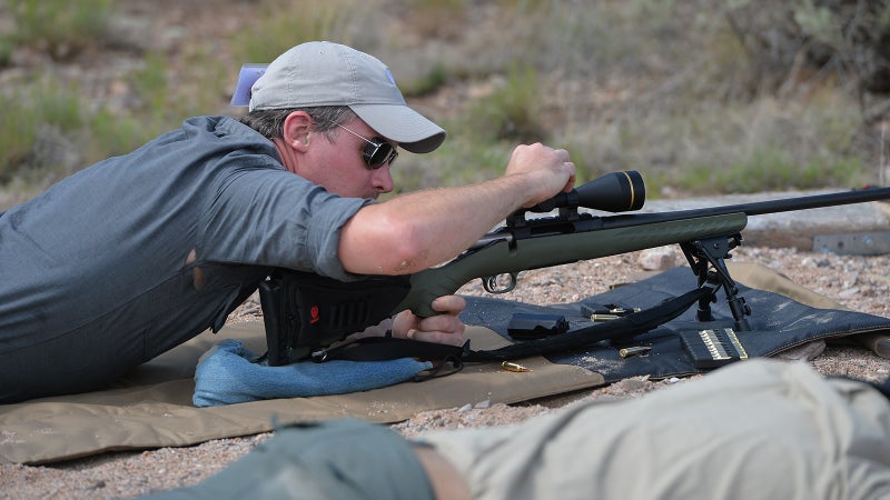 Reaching out for 1,000, I adjust elevation on my Leupold. Didn't realize this shirt had holes in it until I saw this picture!