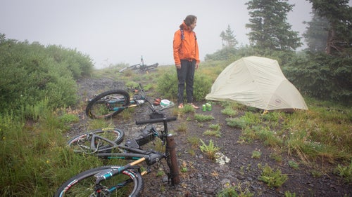 After the steepest and most brutal hike-a-bike any of us had ever experienced, we finally made it to a beautiful lake nestled high above Telluride, where we camped. Unfortunately, heavy rain resulted in frustrating fishing and lots of tent time. Here, Sam Simmons surveys our camp between downpours.