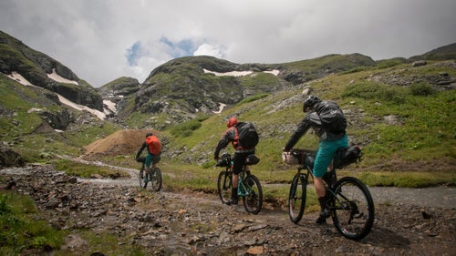(Left to right) Reiter, Stucki, and Simmons ride past old tailings piles on their way to the top of Bridal Veil Basin on the third day of our quest.