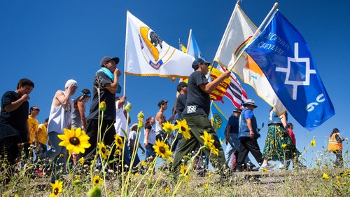 As of early September, organizers were estimating that members of nearly 300 Native American tribes had flocked to North Dakota to oppose construction of the Dakota Access Pipeline. Here, flags from the Cheyenne River Sioux, the Yankton Sioux, Lower Brule Sioux, Apsaalooke (Crow) Nation, and others fly during a march to a pipeline construction site.