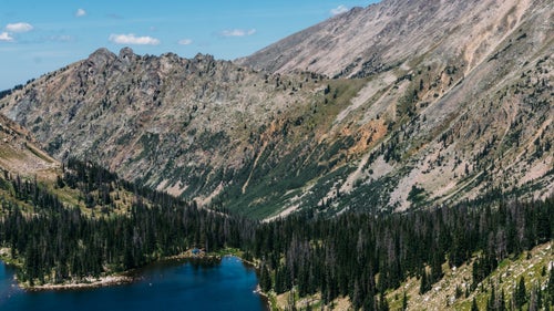 On the second night, hikers camped on the shores of Kelly Lake. Snow was still visible on the peaks above and the lake teemed with trout.