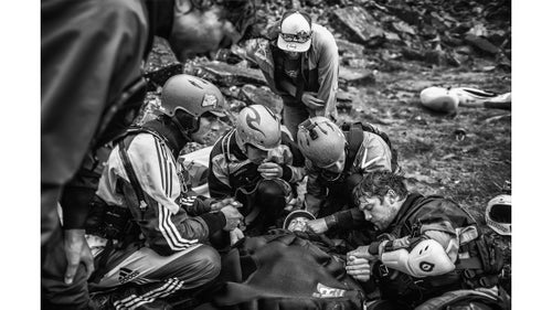 Spirit category winner by Dean Treml
Josh Neilson (center) of New Zealand is supported by fellow paddlers as he waits for a helicopter evacuation after a bad landing off Matze's Drop, Storulfossen, Norway on July 7, 2014. It left him with a broken L1 vertebrae.鈥