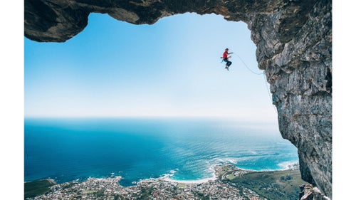 Wings category winner by Micky Wiswedel
Wiswedel and climber Jamie Smith (pictured) had been setting routes in the area. 鈥淲ith climbing photography it鈥檚 not often you can just walk somewhere to get a good angle鈥攎ost good shots require some form of rigging,鈥 Wiswedel says. 鈥淭he angle of this image happened by chance. We were setting up for another shot but when I looked back I knew we had to change plans and grab the shot with the sea and horizon in the background, framed by this huge rock roof.鈥