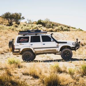 Toyota’s Land Cruiser, arguably the most iconic four-wheel drive ever made, went into production in 1954. Since then, the company has released many iterations of this vehicle, all of which have a reputation for indestructibility and bet-your-life-on-it reliability. To celebrate the car’s legacy, Land Cruiser owners from all over the U.S. gather each year at the Land Cruiser Heritage museum in Salt Lake City for Cruiser Fest. This year, we sent photographer  Louis Arevaloto photograph the drivers, their steeds, and some special edition Land Cruisers that live in the museum. 
Photo: Luis Vassallo, from Weston, Florida, with his 2005 FJ80 during a stop in Eureka, Utah, on the way to the event. Vassallo was part of an overland group that drove on dirt roads from Green River, Utah, to Salt Lake City.