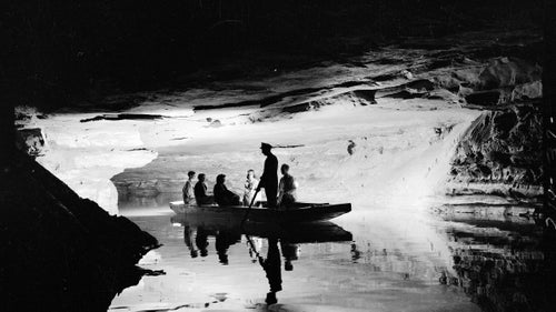 This dramatic shot from 1939 shows visitors on a guided boat tour of Echo River in Mammoth Cave. The boat tour was a huge attraction at the park, but was discontinued in 1990 in order to protect aquatic species.