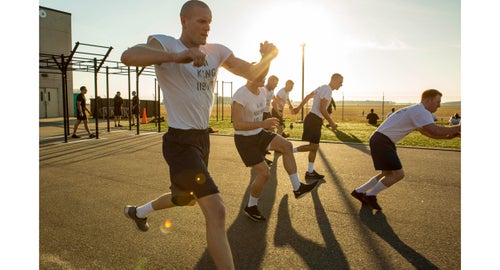 AN Steven King (left) and AN Tyler Sojka (middle front) doing the daily morning workout.