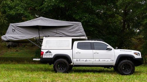 The Tacoma is capable on its own, but this model, owned by Goose Gear, is made even better thanks to a Habitat camper shell with an aluminum, fully waterproof tent that folds open in seconds. Goose Gear also retrofitted the truck with a shower and sink fed by an onboard hot water heater, a foldout table and chairs, a toilet, and room to sleep three adults. They call it a five-foot RV.
