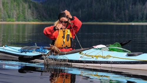 Crabbing was a new endeavor for us, and actually turned out to be quite profitable. In shallow, protected waters, we experimented with various ways to catch crabs, including reaching down and grabbing them. The baited crab ring in this photo was one of the best methods.