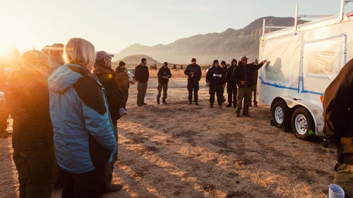 Morning briefing at the Hunter Peak Fire (2016) in Wyoming. No matter the fire’s scale, morning and evening briefings are conducted each day to give the crews and overhead staff information on what the next 24 hours will bring for each unit. Weather shifts on a fire can alter plans instantly, so communication between crews in tents and on the line is essential.