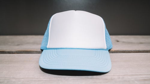 The polyester Two Tone comes in a ton of colors and is dirt cheap. Plus, the blank front stands out in a sea of logos.