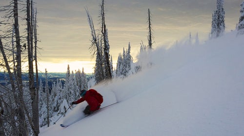 David “Powder” Steele enjoys a late-night turn en route to Yurt Ski, a yurt in Montana’s Swan Mountains.