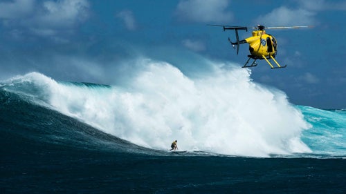 The wind and chop knocked Enever off the wave shortly after the drop, but Palmateer was able to hold on into the flats through an avalanche of white water.