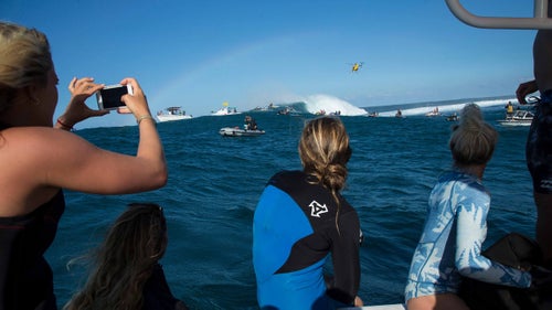 It was important to the women that their event be held on the same day as the men's in order to share the viewing audience. The Pe'ahi Challenge was the most watched event for the World Surf League last season, and this year's was expected to nearly double, thanks to the addition of the women's competition. Sharing the day also enabled the athletes to cheer for, and help each other throughout the day. From left to right: Felicity Palmateer, Tammy-Lee Smith, Paige Alms, and Laura Enever watch the men's final from the competitor boat.