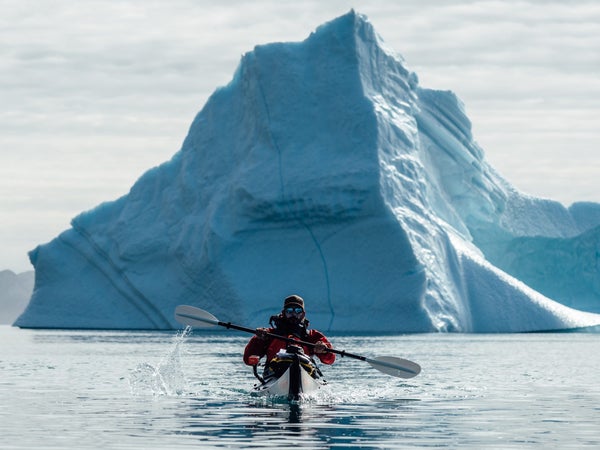 Andrew paddles a folding Oru kayak through a fjord in eastern Greenland.