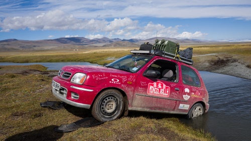 How about this for a vacation idea? Fly to Europe, buy a beat-up clunker, then try to make it from England to Mongolia in one piece. There鈥檚 no official route and no official rulebook. Photographer Drew Gurian and his brother, Scott, did just that this summer as participants in the Adventurists鈥 Mongol Rally. They bought 990ML 60-horsepower Nissan Micras, and after 53 days, 18 countries, a couple broken axles, and an emergency extraction, they crossed the finish line. We talked to to the New York City鈥揵ased photographer about some of his most memorable times on the road. Photo: Every day brought a different hole that we needed to be pulled out of. Here, our friends and adventure mates Rosi Moore-Fiander and Jane Box help us out of a crossing that proved too deep.