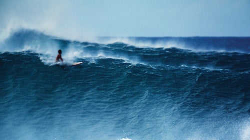 Pipeline, Oahu, Hawaii, December 1978. Another classic Pipeline shot of solo surfer feeling a huge set roll toward the beach.