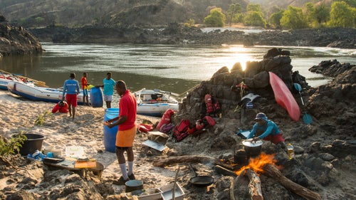 On the second night, an 11-man local crew helped our group of 20 with gear and supplies to set up one of the best campsites of the trip. It featured a croc-free riffle, which served as a natural hot tub for us tired paddlers. In the evening, we enjoyed a sing-along, led by our main guide, Hippo. The songs were basically local nursery rhymes, but they were easy to learn, and the group loved it.