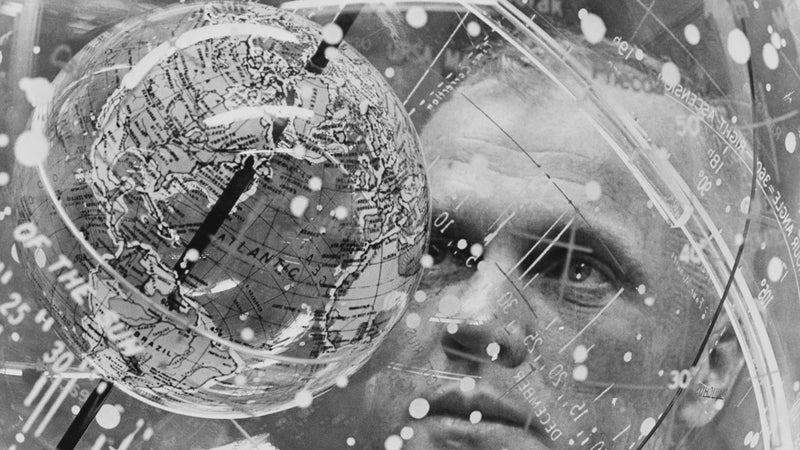 Astronaut John H. Glenn Jr. looks into a Celestial Training Device (globe) during training in the Aeromedical Laboratory at Cape Canaveral, Florida.