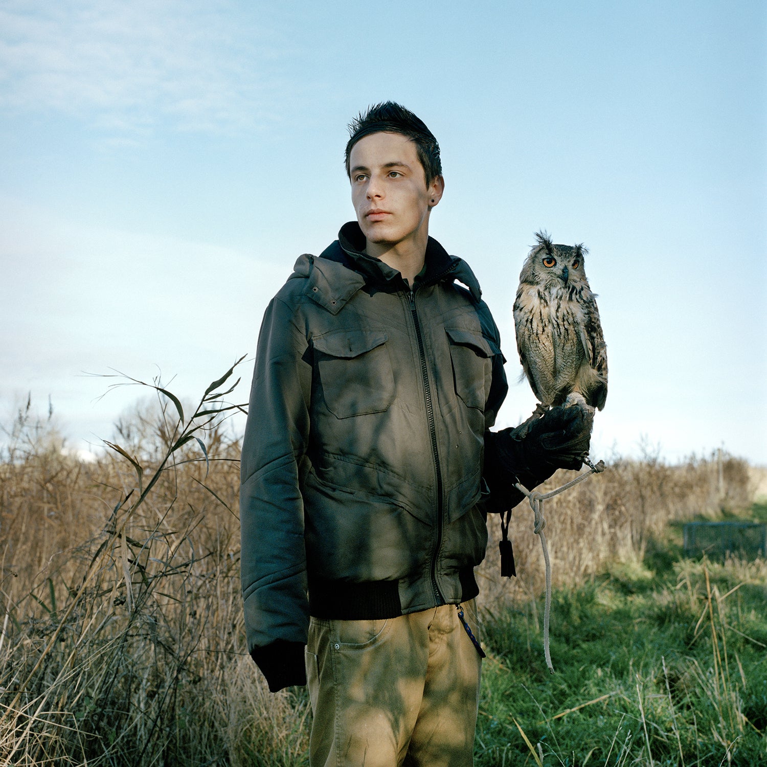 Kevin holding a Bengal Eagle Owl named Boedah. This image is a success for me as it shows the calmness between the bird and the child through their eyes and posture, which was a goal from the onset.