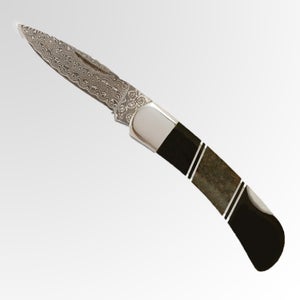 This knife has is made from dinosaur bone.
