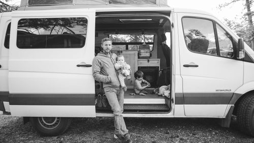 The man鈥檚 got a Sprinter, too. Here he holds his daughter, Ingrid, while his son, Fitz, plays with toy trucks.