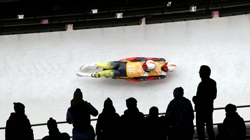 The German doubles team of Tobias Wendl and Tobias Arlt speed down the track during the luge team relay competition at the 2014 Winter Olympics, Thursday, Feb. 13, 2014, in Krasnaya Polyana, Russia. Germany won the gold medal. (AP Photo/Charlie Riedel)