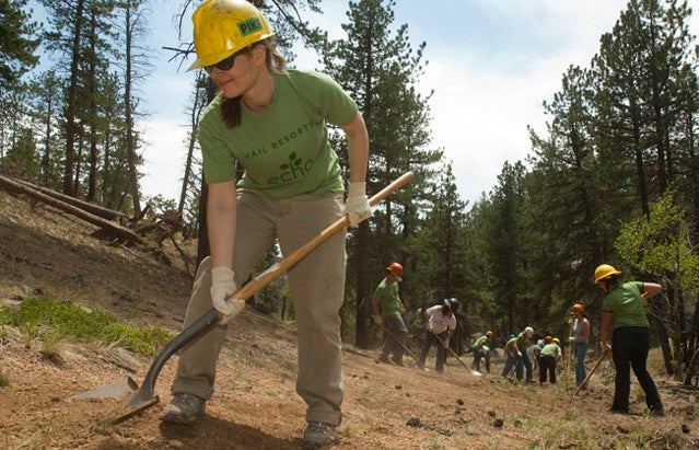 Jugita Krilaviciute, left, works the soil during the Vail Resorts Hayman Restoration Project in the Trail Creek drainage on Thursday, June 2, 2011. The Vail Resorts Hayman Restoration Project is in the second of a three year, $750,000 partnership with the U.S. Forest Service and The Rocky Mountain Field Institute to restore lands damaged by the 2002 Hayman wildfire, the largest in Colorado's history. Vail Resorts Photo by Peter M. Fredin.