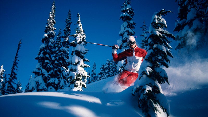 Skier riding through powder, Whistler, British Columbia, Canada, low angle view