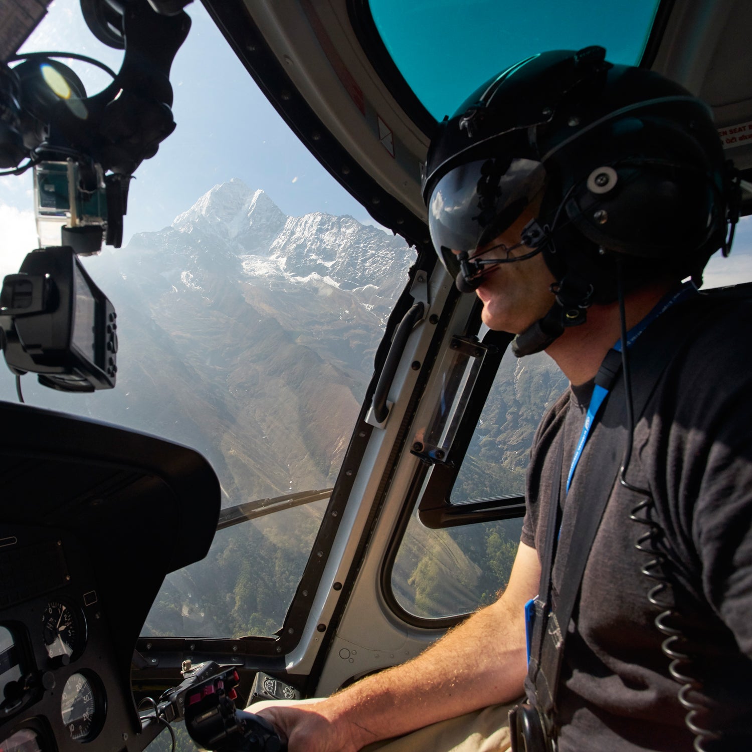 Manang Air helicopter pilot Ryan Skorecki flying to the village of Pheriche, Sagarmatha National Park, Nepal.