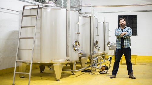 Sebastian Gomez Camorino stands in front of his distillery in Osorno, Chile, where he makes a new clear liquor called հäá.