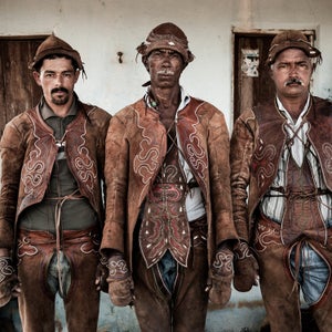The cowboy culture of the American West takes a historical backseat to every other region in the Americas. But whether in Texas or Uruguay, the core of a cowboy is the same: a connection between man, animals, and the land. Brooklyn-based photographer Luis Fabini, who was born in Uruguay, spent the last decade photographing these men across North and South America and has narrowed down thousands of images into a new book called Cowboys of the Americas. Here, Fabini shares some his favorites images and characters from book. 
Photo: Vaqueiros in Brazil. Their handmade leather armor not only protects the men from the burning sun, but also shields them from bare branches and long, sharp needles of the surrounding bush.