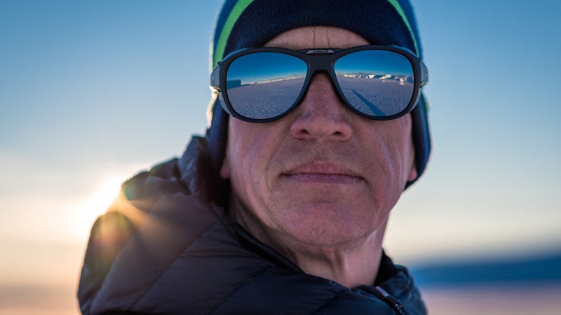 Mike Horn stares out at the Antarctic ice in his Julbo Explorer 2 glacier glasses before departing on his solo, unsupported crossing of the continent.